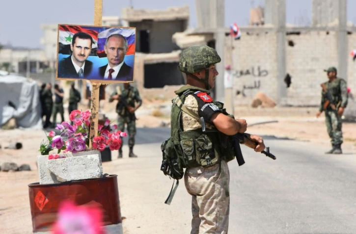 Des soldats russes et syriens au point de passage d'Abu ad Duhur, dans la province d'Idleb en Syrie, le 20 août 2018