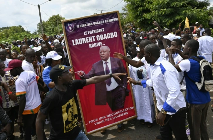 Des partisans de l'ex-président Laurent Gbagbo lors d'une manifestation en prélude à son retour en Côte d'Ivoire, à Mama le 13 juin 2021