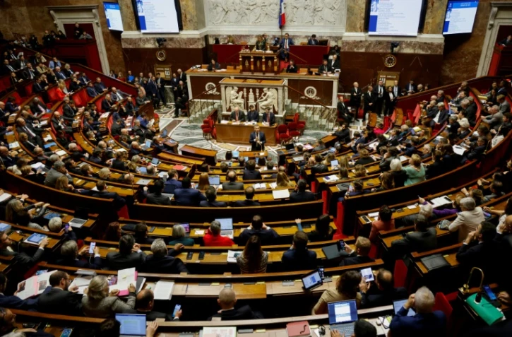 Le ministre de l'Intérieur Gérald Darmanin à l'Assemblée nationale à Paris le 11 décembre 2023, jour où une motion a rejeté son projet de loi immigration