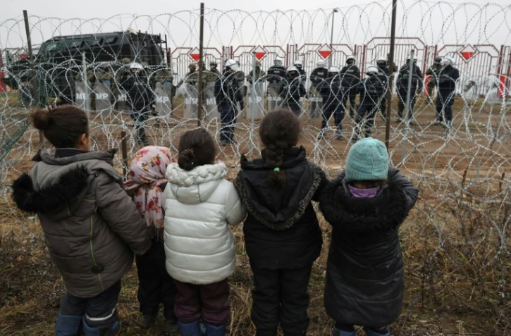 Des migrants près du camp Bruzgi-Kuznica, au Belarus, à la frontière avec la Pologne, le 17 novembre 2021