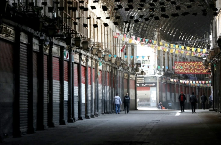 Le souk Al-Hamidiyé dans le vieux Damas quasimement déserté après la fermeture des magasins en raison du nouveau coronavirus, le 24 mars 2020