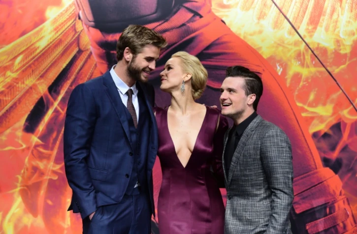 (g-d) Les acteurs Liam Hemsworth, Jennifer Lawrence et Josh Hutcherson lors de l'avant-première du dernier opus de Hunger Games à Berlin le 4 novembre 2014