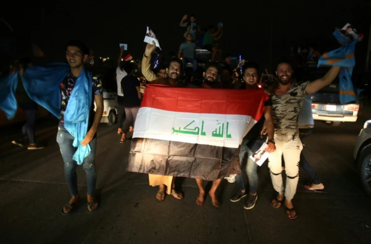 Des Irakiens lors des législatives en Irak, le 14 mai 2018 ) Bagdad