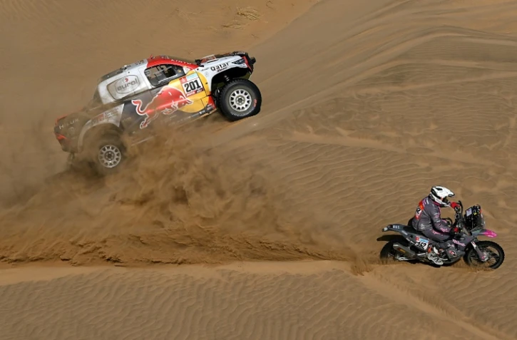 Le Qatarien Nasser al-Attiyah, au volant de sa Toyota, lors de la 11e étape du Dakar-2022, le 13 janvier 2022 autour de Bisha