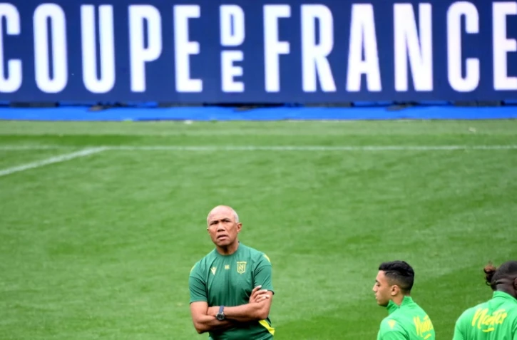 L'entraîneur du FC Nantes Antoine Kombouaré (centre) au Stade de France, le 28 avril 2023 à Saint-Denis, la veille de la finale de la Coupe de France contre Toulouse