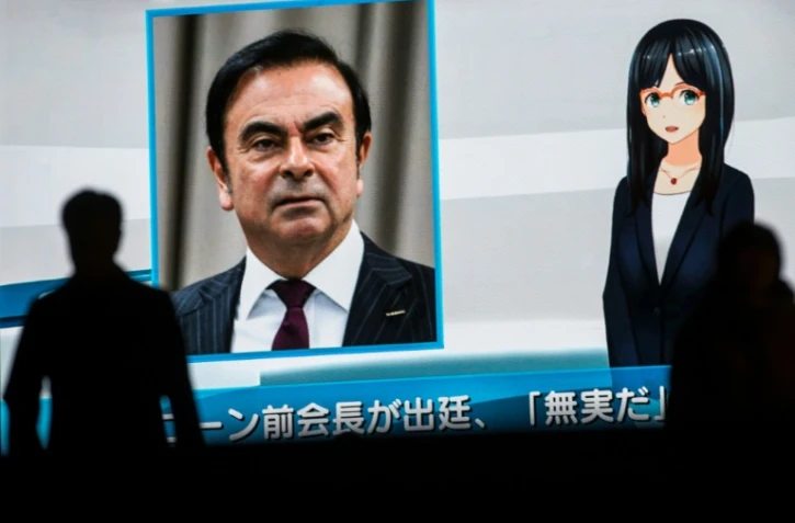 La télévision japonaise diffuse des informations sur Carlos Ghosn sur un écran géant, le 8 janvier 2019 à Tokyo