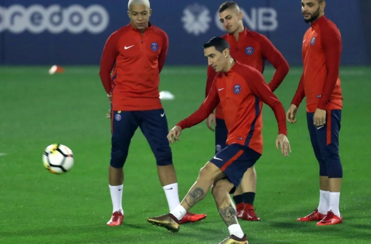 Le milieu du PSG Angel Di Maria (c) lors d'une séance d'entraînement, le 21 décembre 2017 à Doha