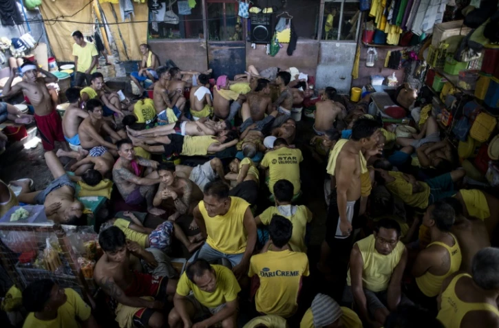 Des détenus dans la prison de Quezon City à Manille le 11 juillet 2017