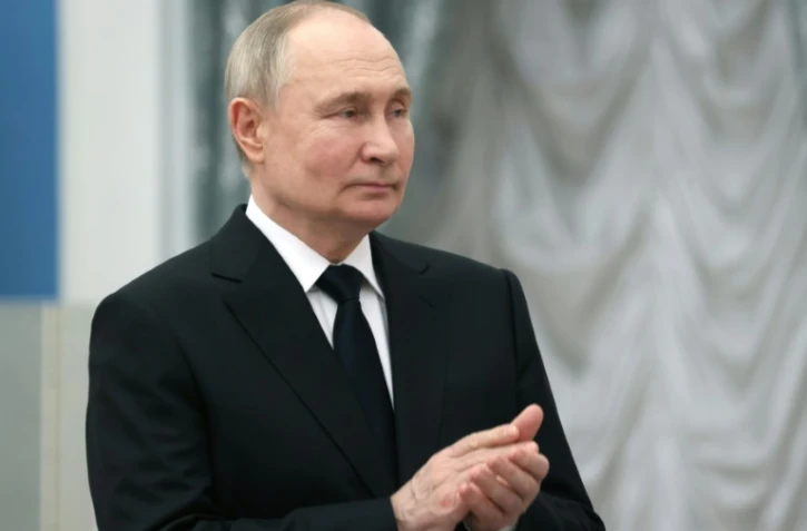 Photo diffusée par l'agence russe Spoutnik du président Vladimir Poutine s'exprimant lors d'une cérémonie au Kremlin le 26 mars 2024