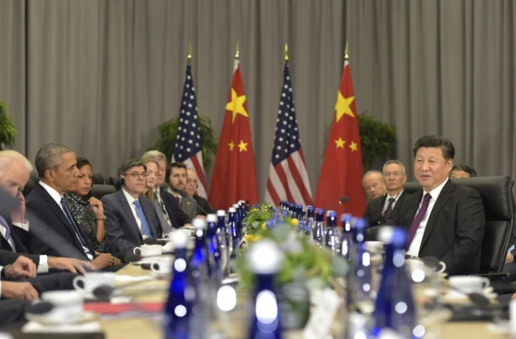 Le président américain Barack Obama (g) et le président chinois Xi Jinping(d) lors d'une rencontre bilatérale en marge du sommet sur la sécurité nucléaire à Washington le 31 mars 2016
