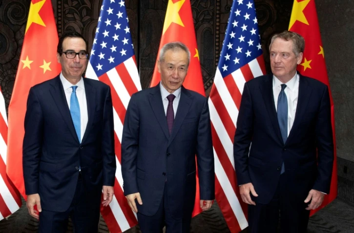 Le secrétaire au Trésor Steven Mnuchin (g) le vice-Premier ministre chinois Liu He (c) et le représentant américain au Commerce Robert Lighthizer (d), le 31 juillet à Shanghai, en Chine