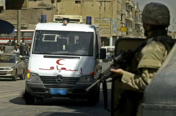 Un double attentat suicide a fait lundi au moins 26 morts, en majorité des travailleurs journaliers, dans le centre de Bagdad