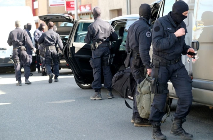 Des membres du GIGN devant le supermarché Super U de Trèbes après une prise d'otages, le 23 mars 2018