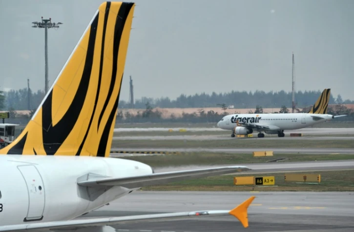 Un Airbus A320 de la compagnie singapourienne Tigerair sur le tarmac de l'aéroport international Changi le 12 novembre 2015 à Singapour
