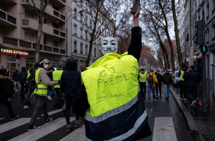 Des Gilets jaunes lors d'une manifestation à Lyon le 22 décembre 2018