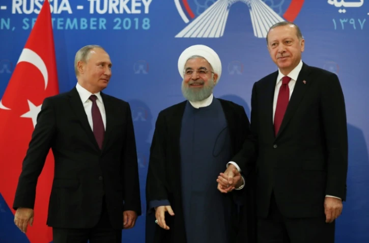Photo fournie par la présidence turque montrant les présidents russe Vladimir Poutine, iranien Hassan Rohani et turc Recep Tayyip Erdogan au sommet tripartite à Téhéran, le 7 septembre 2018