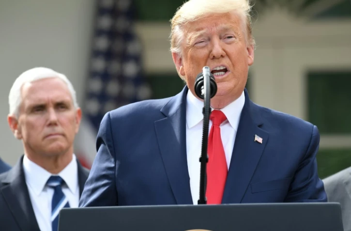 Le président américain Donald Trump s'exprime lors d'une conférence de presse dans les jardins de la Maison Blanche, le 13 mars 2020
