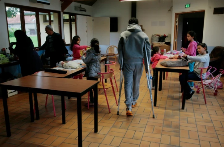 Des réfugiés dans un centre d'accueil à Cergy le 16 septembre 2015