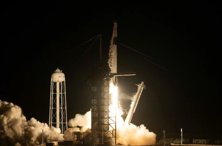 Décollage de la fusée Falcon 9 de SpaceX avec la capsule Crew Dragon, le 2 mars 2019 depuis le Centre spatial Kennedy en Floride
