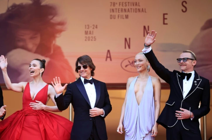 (g-d) L'actrice britannique Hayley Atwell, l'acteur américain Tom Cruise, l'actrice française Pom Klementieff et l'acteur britannique Simon Pegg arrivent pour la projection du film "Mission: Impossible- The Final Reckoning" au 78 Festival de Cannes, le 14 mai 2025