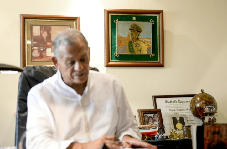 Mohamed Anouar al-Sadate dans son bureau près du Caire, avec en arrière plan une photo de son oncle Anouar, le président égyptien qui signa la paix avec Israël. Photo du 13 septembre 2018