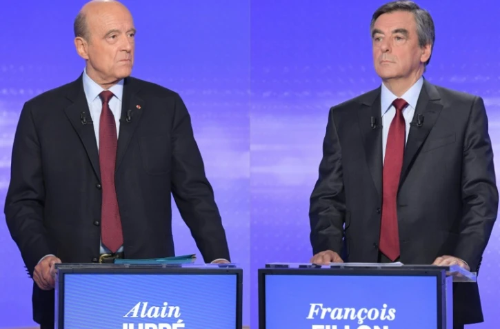 Photomontage fait le 21 novembre 2016 de photo d'Alain Juppé (g) et François Fillon, candidats à la primaire de droite 