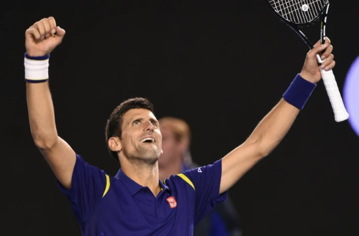 Le Serbe Novak Djokovic célèbre sa victoire contre le Britannique Andy Murray lors de la finale de l'Open d'Australie, à Melbourne, le 31 janvier 2016