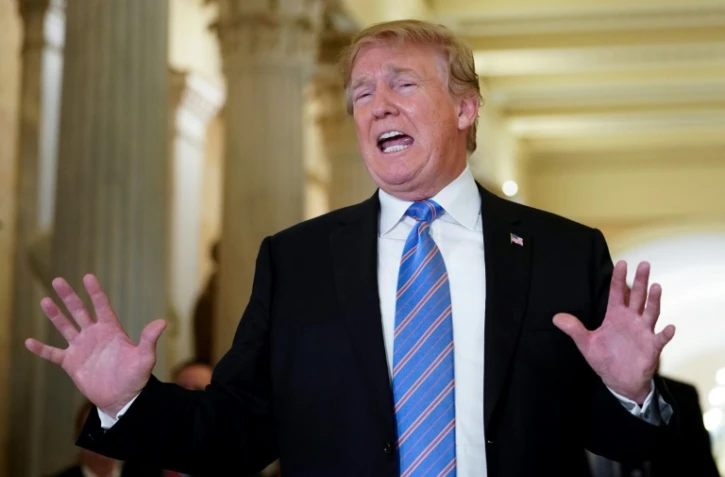 Le président américain Donald Trump après une réunion sur une réforme de l'immigration au Capitole avec des élus républicains de la Chambre des représentants, le 19 juin 2018 à Washington