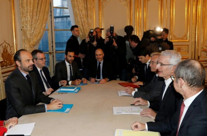 Réunion à Matignon sur les réformes de la SNCF préconisées par le rapport Spinetta avec notamment le Premier ministre Edouard Philippe (2e g) et le président de la SNCF Guillaume Pepy (2e d), le 19 février 2018 à Paris