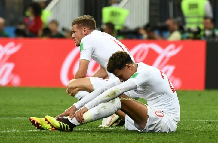 La tristesse des Anglais Jamie Vardy (g) et Dele Alli après l'élimination par la Croatie en demi-finale du Mondial, le 11 juillet 2018 à Moscou