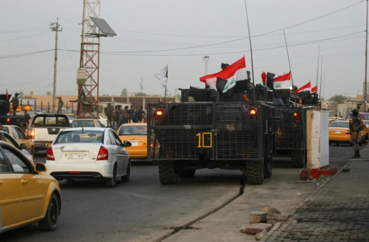 La police irakienne déployée dans une rue du quartier chiite de Sadr City, à Bagdad, le 7 octobre 2019