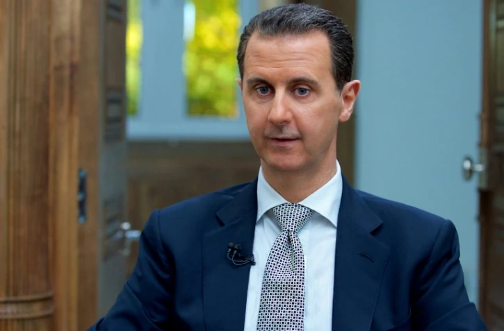 Le président syrien Bachar el-Assad lors d'une interview à Damas accordée à l'AFP le 12 avril 2017