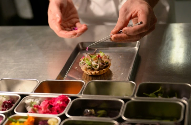 Dans les cuisines du restaurant Pineapple and Pearls, le 21 septembre 2016 à Washington