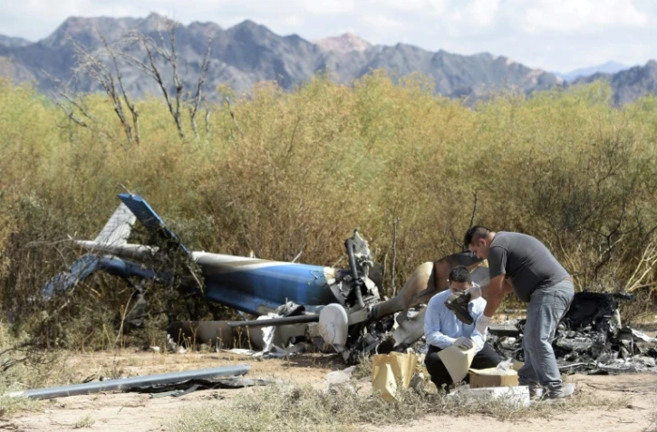 Photo prise le 10 mars 2015 des hélicoptères détruits dans la collision qui a coûté le vie à dix personnes sur le tournage de l'émission "Dropped" près de Villa Castelli, dans la province de La Rioja, en Argentine