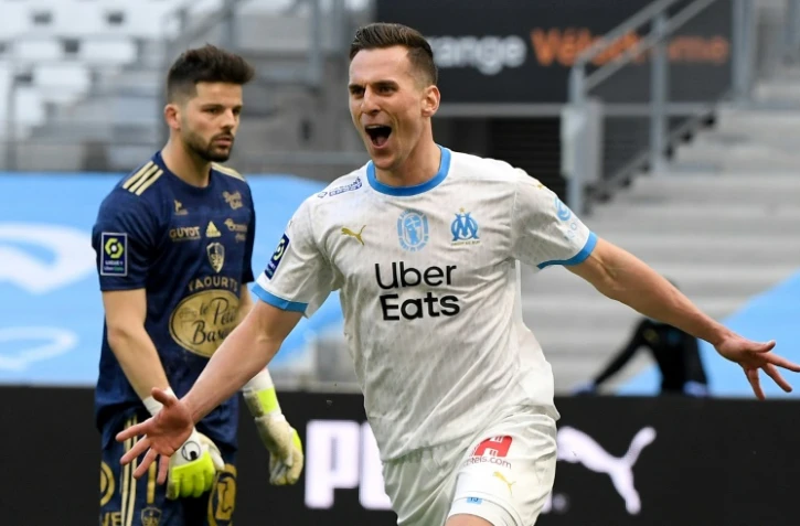 La joie de l'attaquant polonais de Marseille, Arkadiusz Milik, après avoir ouvert le score à domicile contre Brest, lors de leur match de Ligue 1, le 13 mars 2021 au Stade Vélodrome