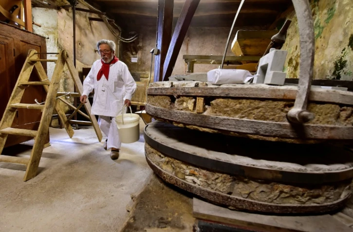 Elie Coustaty dans son moulin à eau du XIVe siècle à Vézac, en Dordogne, le 27 avril 2020