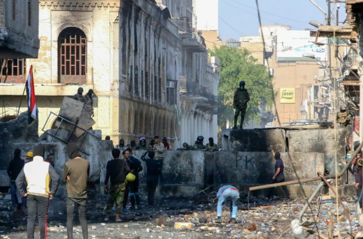 Des manifestants irakiens le 30 novembre 2019 dans la rue al-Rachid, à Bagdad