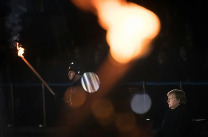 Adieux de la chancelière allemande Angela Merkel aux forces armées lors d'une cérémonie aux flambeaux à Berlin, le 2 décembre 2021