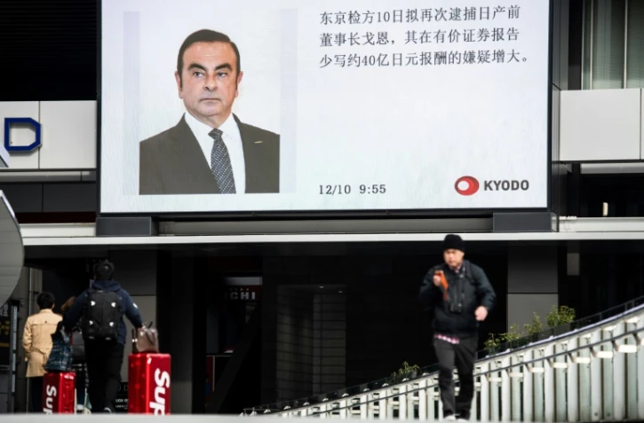 Le portrait de Carlos Ghosn diffusé par la télévision japonaise sur un écran géant à Tokyo, le 10 décembre 2018