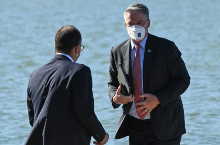 Le secrétaire général de l'OCDE Mathias Cormann (d) arrive au sommet du G20 Finances à Venise le 9 juillet 2021
