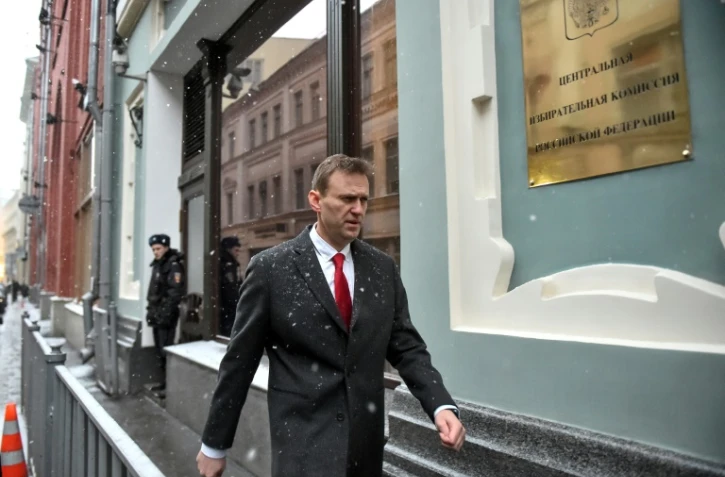 L'opposant russe Alexeï Navalny arrive au siège de la Commission électorale à Moscou, le 25 décembre