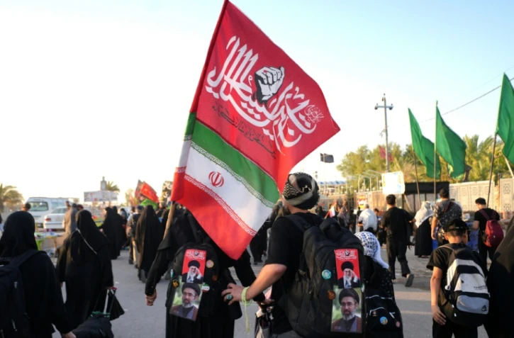 Des pèlerins iraniens dans la ville sainte chiite de Najaf, en Irak, le 25 juillet 2026