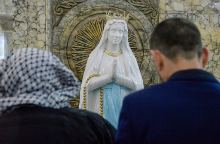 Les chrétiens d'Irak lors d'une messe de Noël
à Qaraqosh, dans la province de Ninive, en décembre 2019