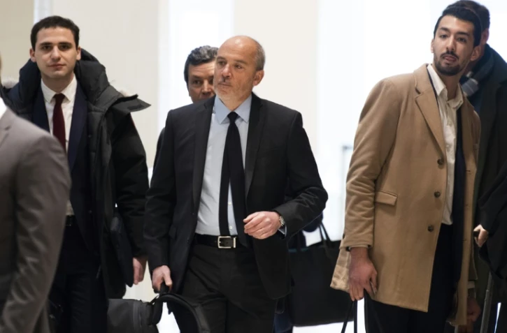 Le PDG d'Orange, Stéphane Richard (c), arrive au tribunal, le 11 mars 2019 à Paris