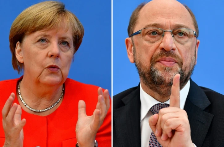 Montage de deux photos d'Angela Merkel (g), le 29 août 2017 à Berlin, et Martin Schulz (d), le 27 juin 2017 à Berlin