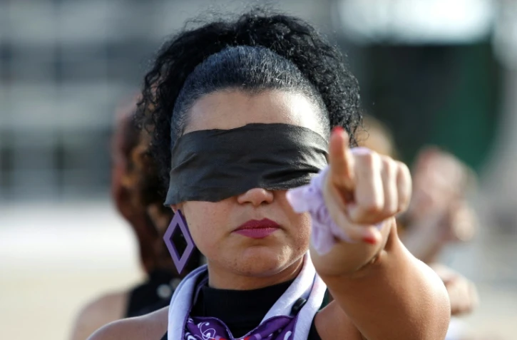 Une Brésilienne manifeste contre les violences sexuelles envers les femmes, le 13 décembre 2019 à Brasilia