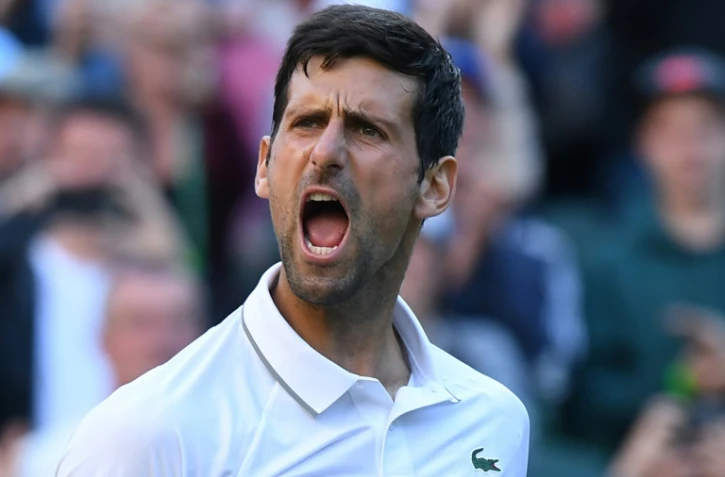 Le Serbe N.1 mondial Novak Djokovic contre l'Américain Denis Kudla au 2e tour de Wimbledon, le 3 juillet 2019 à Londres
