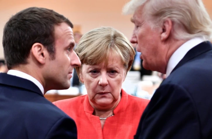 Les présidents français Emmanuel Macron et américain Donald Trump et la chancelière allemande Angela Merkel, le 7 juillet 2017 à Hambourg