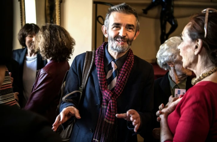 Le journaliste et écrivain français Philippe Lançon s'exprime après avoir reçu le Prix Feminan pour son roman "Le Lambreau" à Paris le 5 novembre 2018