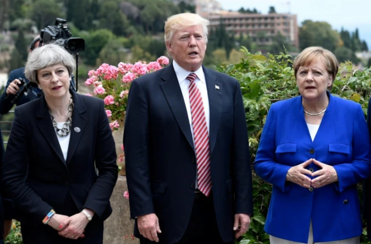 Angela Merkel avec Theresa May et Donald Trump au sommet du G7 le 26 mai 2017 à Taormina, en Sicile